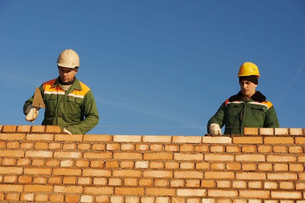 Highland Masonry workers laying bricks